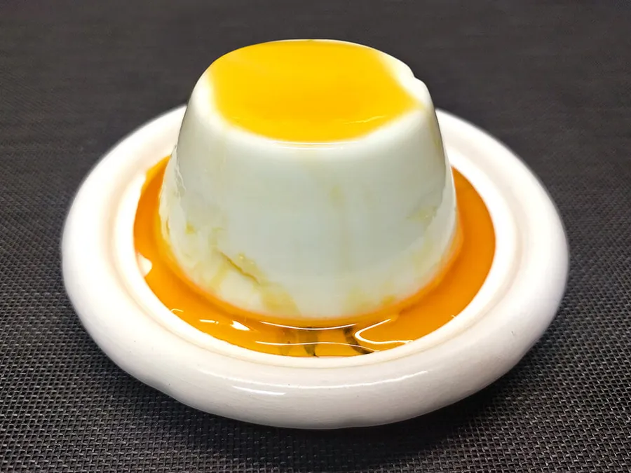 Panna cotta con coulis de naranja
